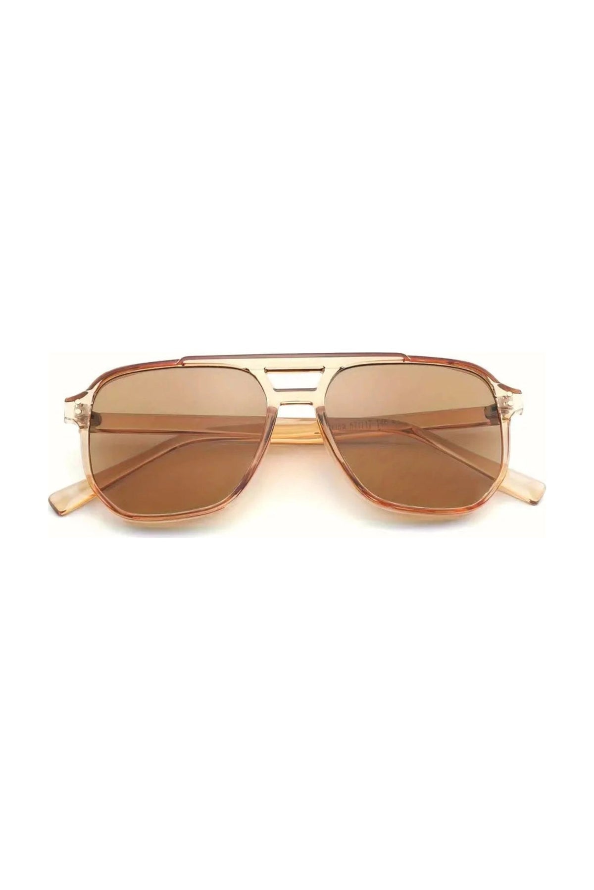 The NUDE sunglasses by SIMI Eyewear feature brown-tinted aviator lenses, a transparent frame, and a decorative double bridge, shown on a white background.