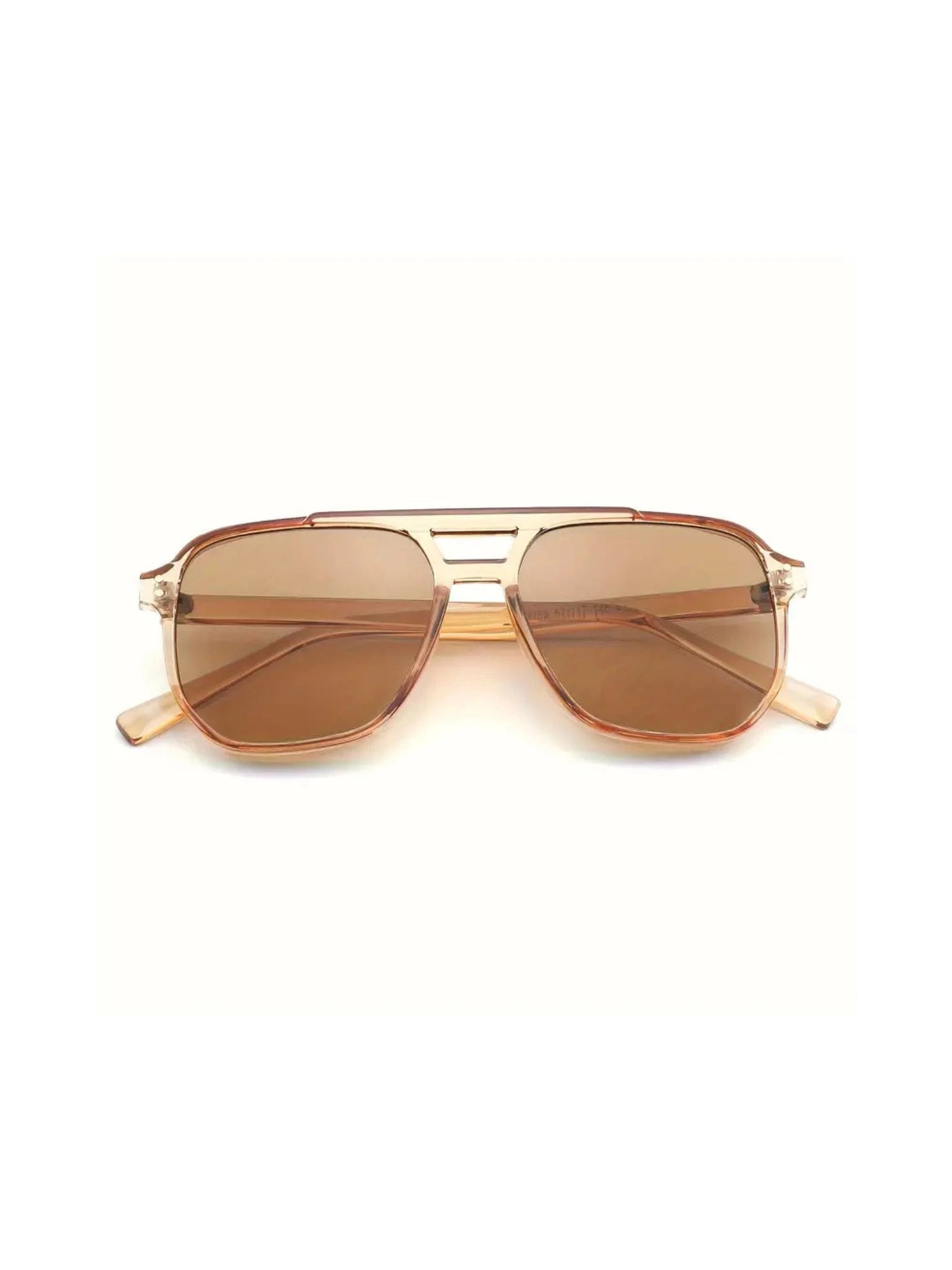 The NUDE sunglasses by SIMI Eyewear feature brown-tinted aviator lenses, a transparent frame, and a decorative double bridge, shown on a white background.
